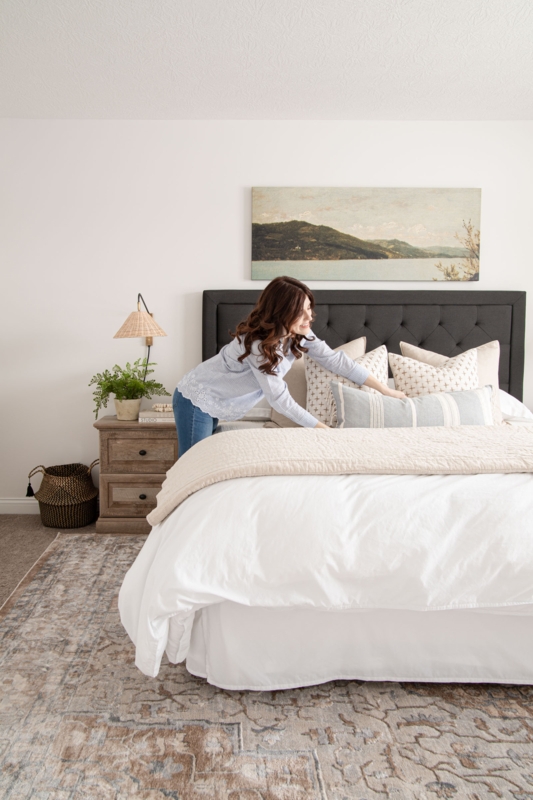 Bed with Charcoal Tufted Headboard and Large Landscape Focal Art.