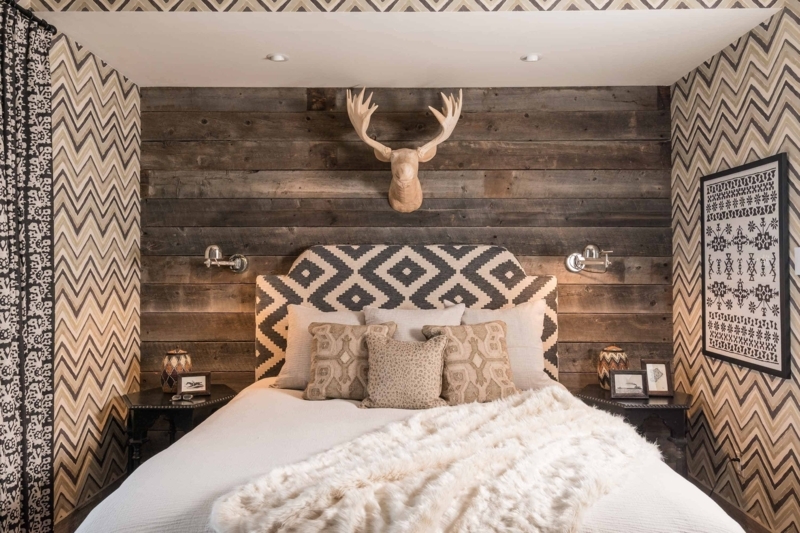 Bed with Diamond Pattern Headboard in Rustic Nook with Faux Moose Head