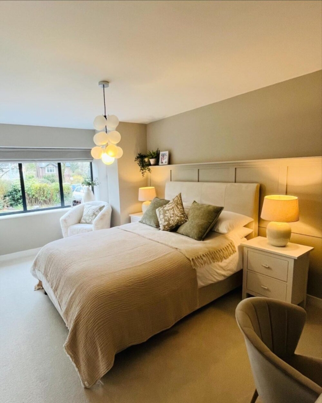 Bed with Modern Cluster Pendant Lighting and Sage Green Accents