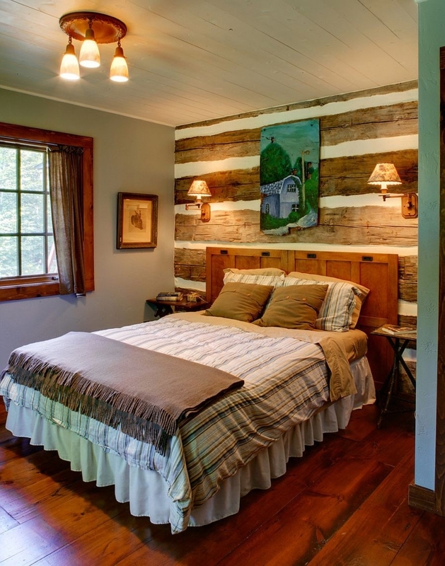 Bed with Panel Headboard against Log Accent Wall with Sconces