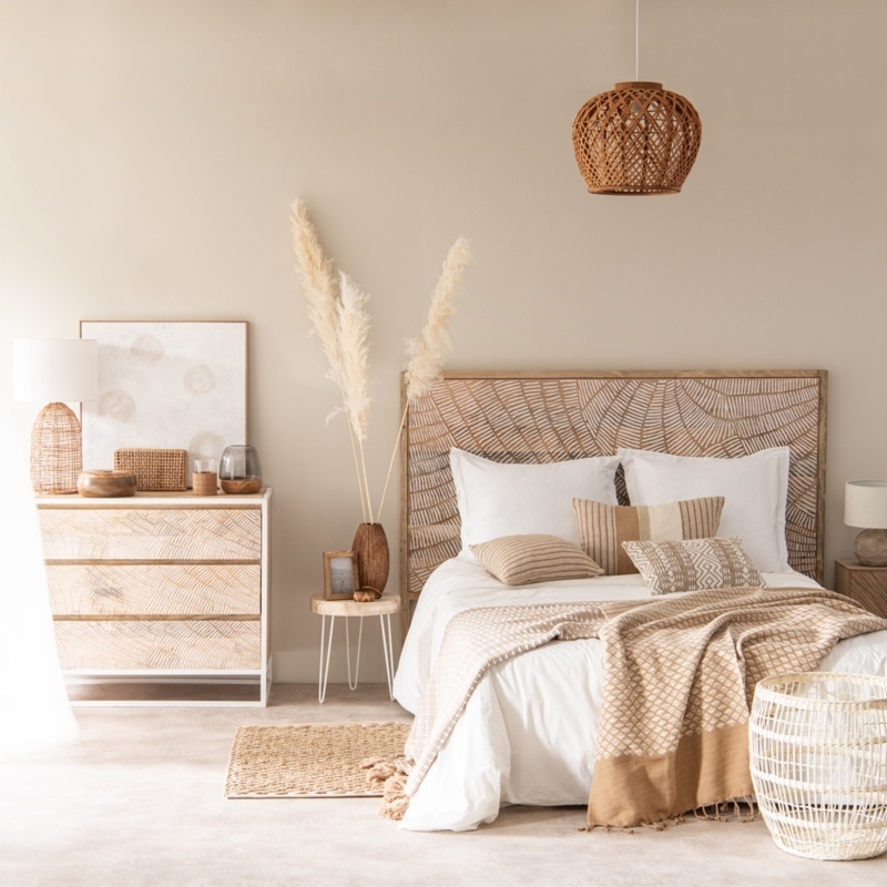 Bed with Patterned Wood Headboard in Boho Chic Neutral Bedroom Design