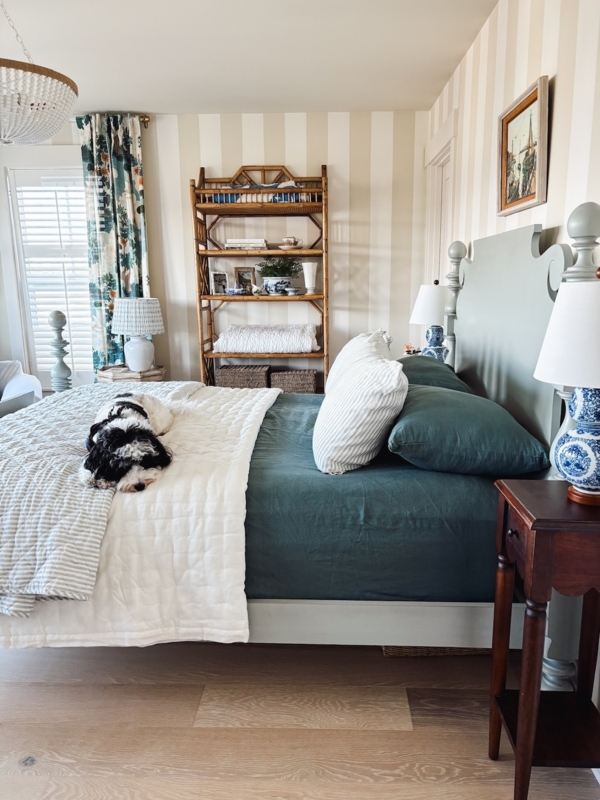Bed with Sage Green Headboard and Striped Wallpaper Decor
