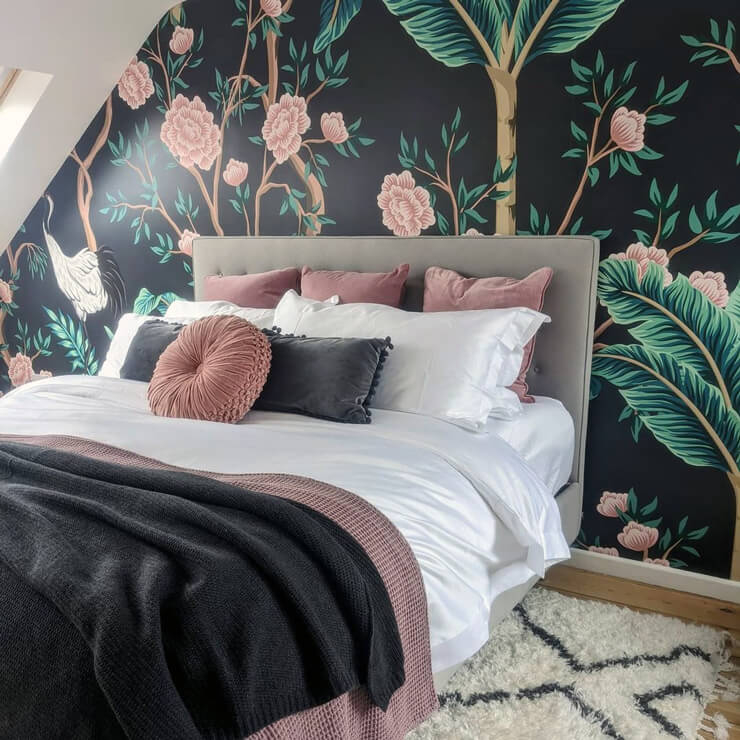 Bed with Tufted Grey Headboard and Dark Oversized Floral Mural Decor