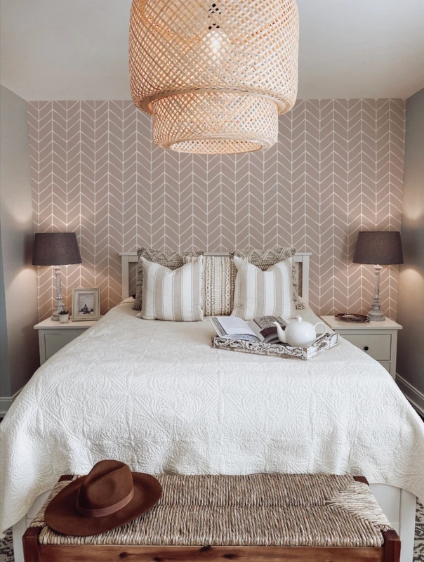 Bedroom Boho Style featuring Herringbone Wallpaper and Woven Pendant
