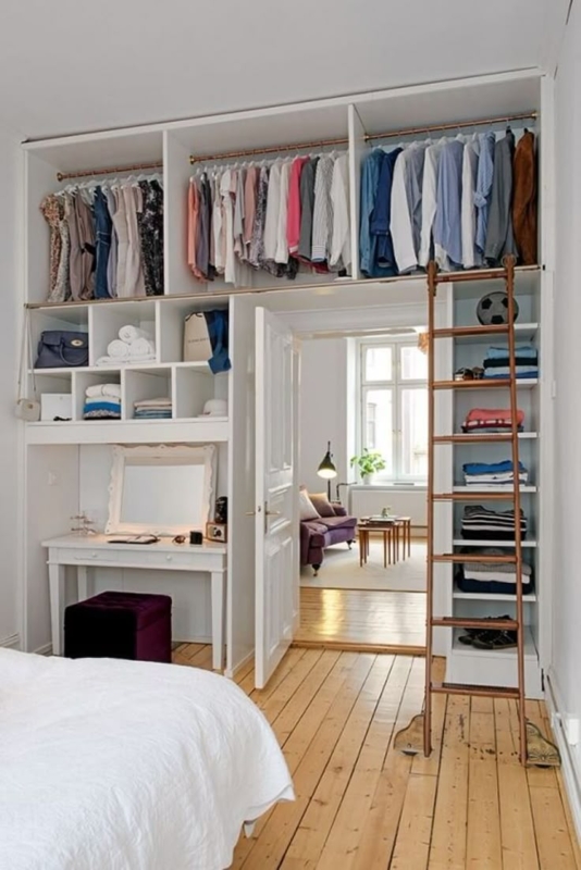 Bedroom Storage with Rolling Ladder and Built-in Vanity
