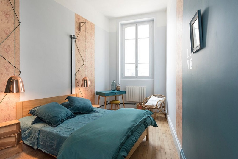 Bedroom with Floral Wallpaper Panels, Teal Bedding and Copper Pendants