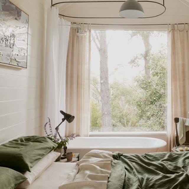 Bedroom with Integrated Bathtub Layout and Forest View Window