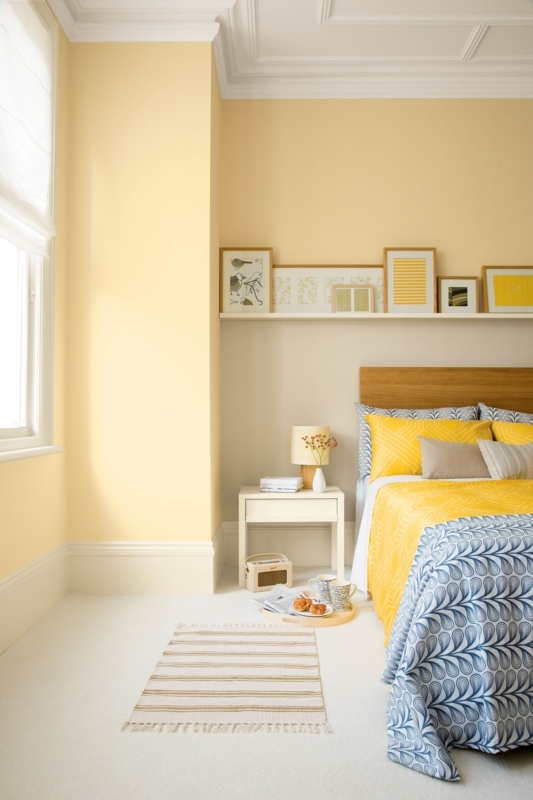 Bedroom with Pale Yellow Walls and Coffered Ceiling Detail
