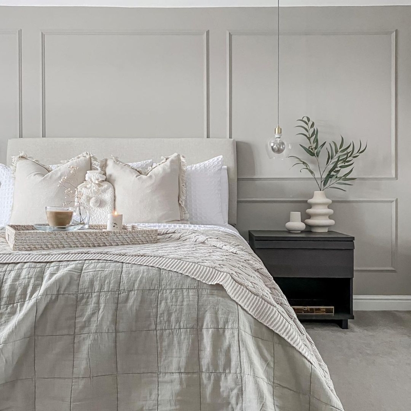 Bedroom with Picture Frame Molding and Contrasting Dark Nightstand