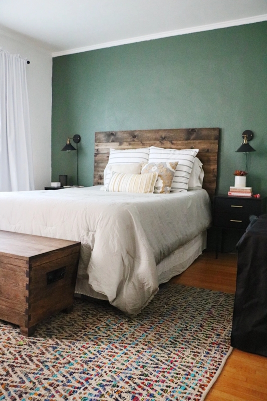 Bedroom with Rustic Wood Headboard and Sage Green Accent Wall