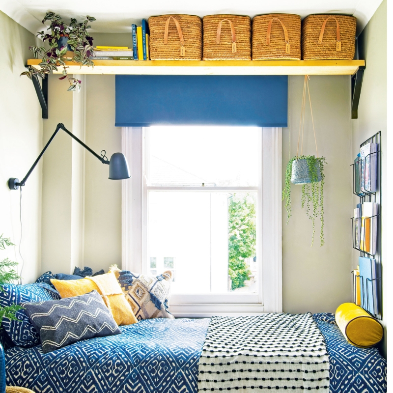 Bedroom with Window Side Bed Layout and High Wall Shelf with Baskets