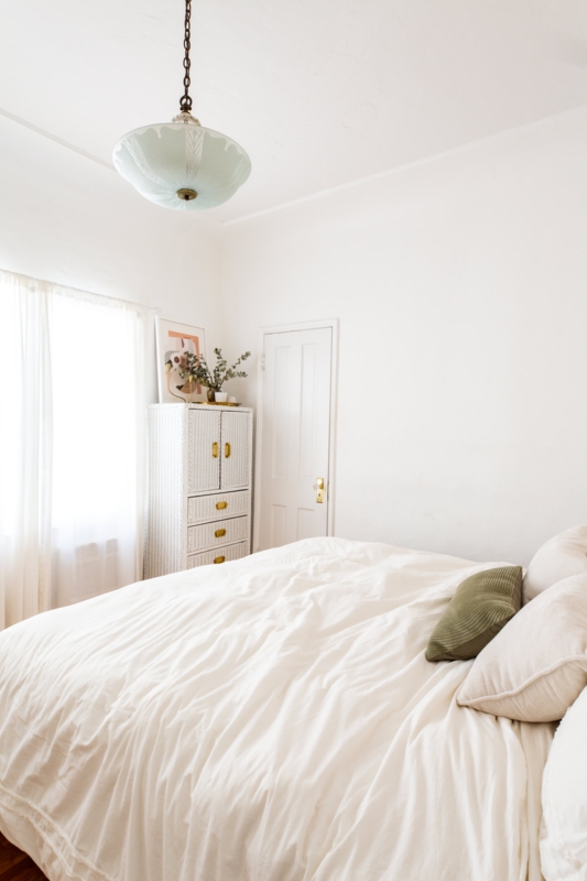 Bedroom with Woven Textured Cabinet and Etched Glass Pendant