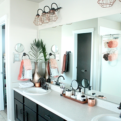 Black Bathroom Vanity with Industrial Copper Cage Light Fixtures