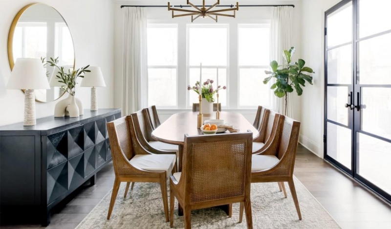 Black Faceted Sideboard with Cane-Back Chairs & Large Round Mirror