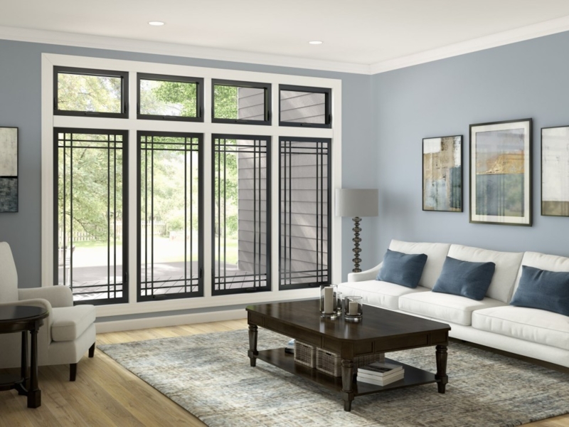 Black Frame Living Room Windows with Geometric Muntins and Blue Walls