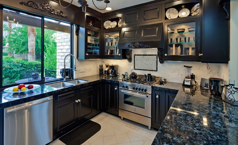 Black Kitchen Cabinets with Granite in a U-Shaped Layout