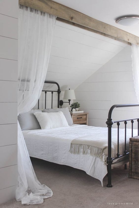 Black Metal Spindle Bed with Sheer Drapes and Shiplap Walls