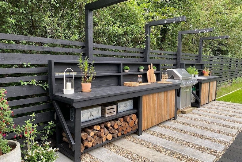 Black Outdoor Kitchen Prep Station with Integrated Firewood Storage