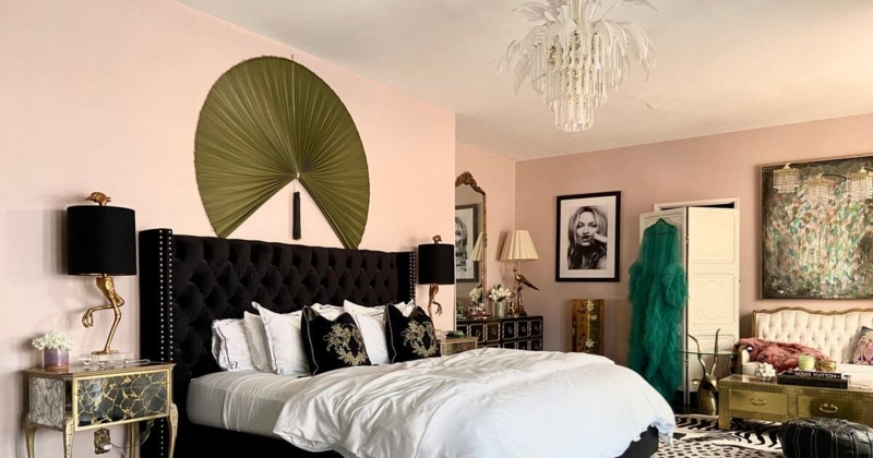 Black Tufted Headboard Decor with Oversized Wall Fan and Blush Pink Walls
