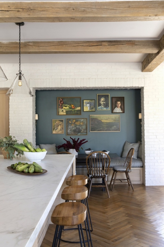 Blue Accent Wall Kitchen Nook with Gallery Wall and Exposed Beams