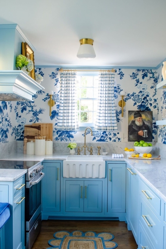 Blue and White Floral Kitchen with Brass Accents and Farmhouse Sink