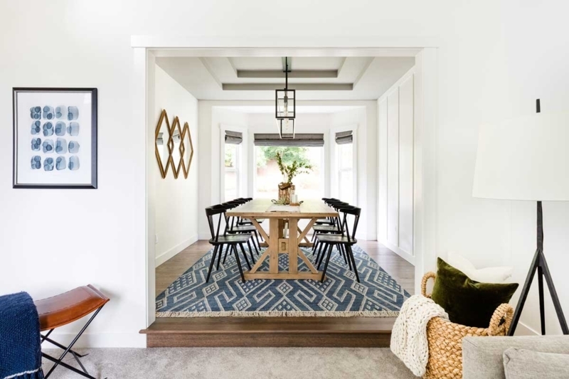 Blue and White Geometric Area Rug under Trestle Dining Table
