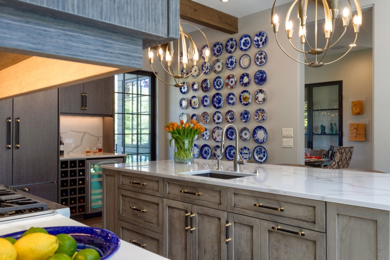 Blue and White Plate Wall Decor in Luxury Kitchen with Grey Island