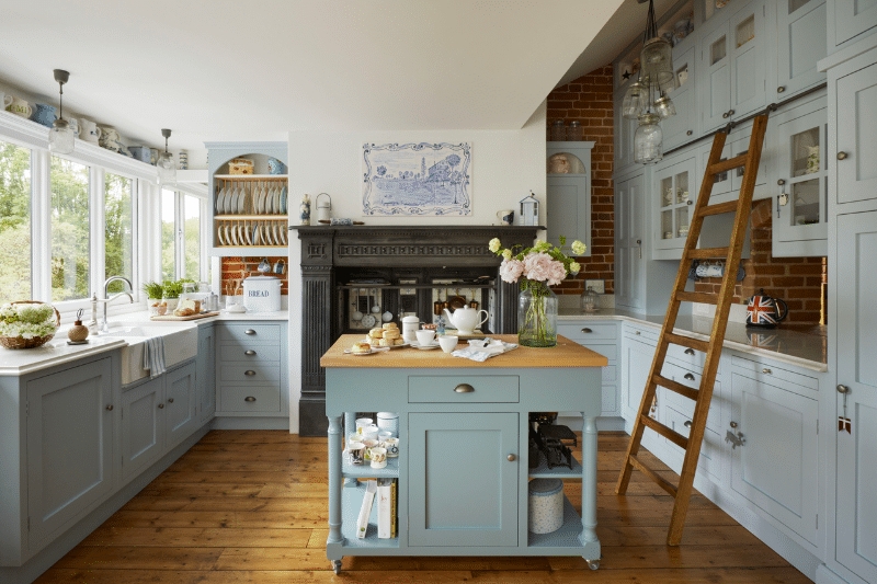 Blue Cabinetry Farmhouse Kitchen With Library Ladder