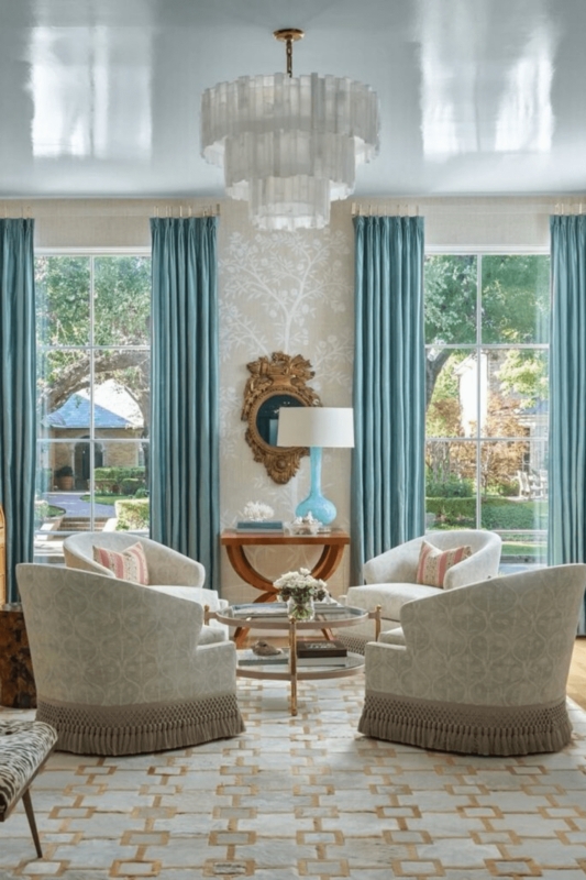 Blue Drapes under High-Gloss Ceiling with Tiered Chandelier