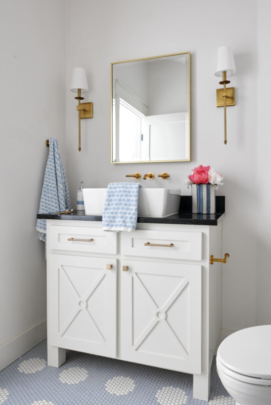 Blue Floral Patterned Bathroom Floor with White X-Frame Vanity