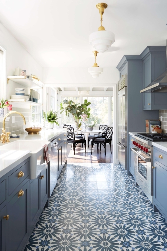 Blue Kitchen Cabinets with Gold Hardware and Patterned Floor