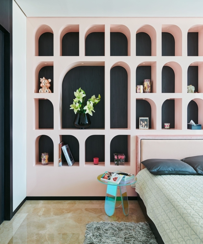 Blush Pink Built-in Wall Unit with Arched Niches and Iridescent Table