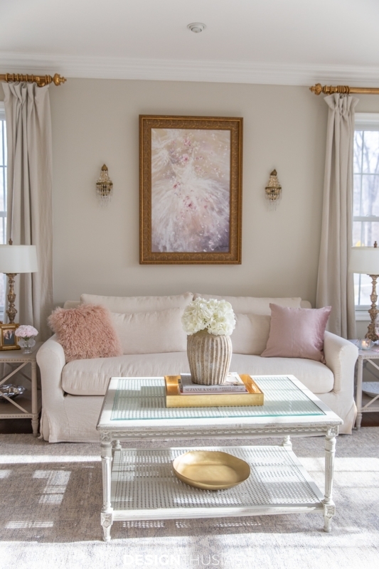 Blush Pink Glam Living Room: Ethereal Wall Art and Gold Trim