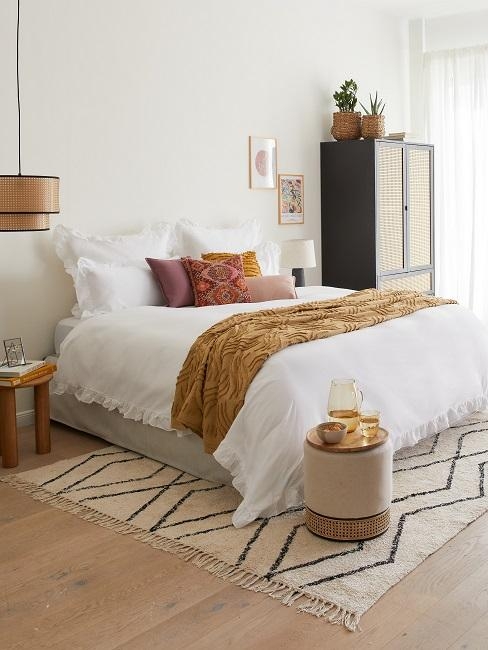 Bohemian Bedroom with Geometric Shag Rug and Ochre Textural Accents