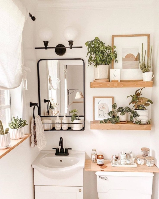 Boho Bathroom with Plants, Matte Black Hardware, and Wood Shelving