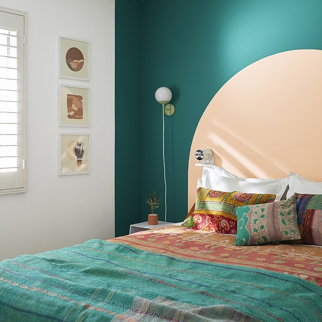 Boho Bed Styling with Painted Wall Arch and Teal and Peach Colors