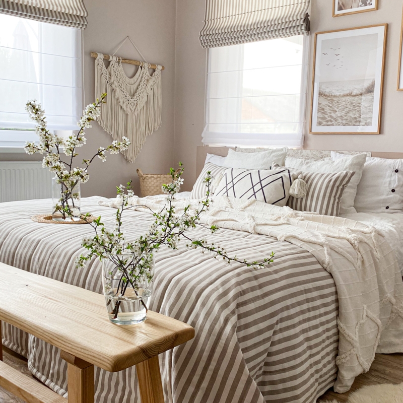 Boho Bed with Macrame Wall Decor and Striped Bedding Accents