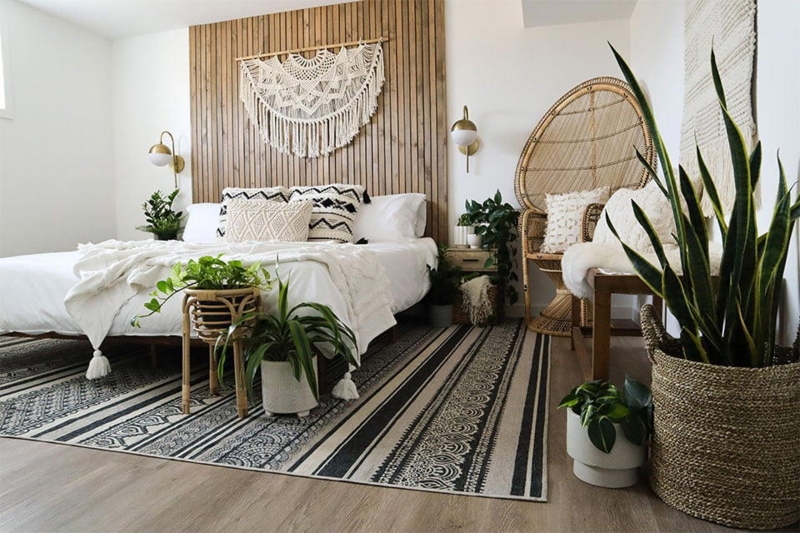 Boho Bed with Wood Slat Accent Wall and Peacock Chair
