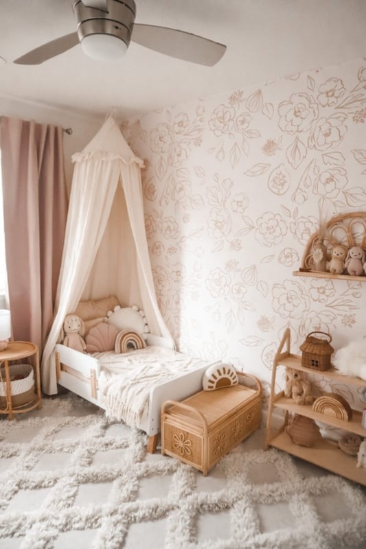 Boho Bedroom with Floral Wallpaper, a Rattan Storage Chest, and a Canopy