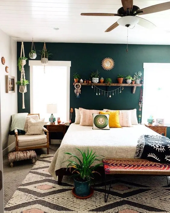 Boho Bedroom with Macrame Hanging Planters and Dark Green Wall
