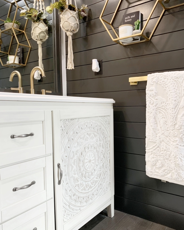 Boho Chic Bathroom Vanity with carved mandala door and black shiplap.