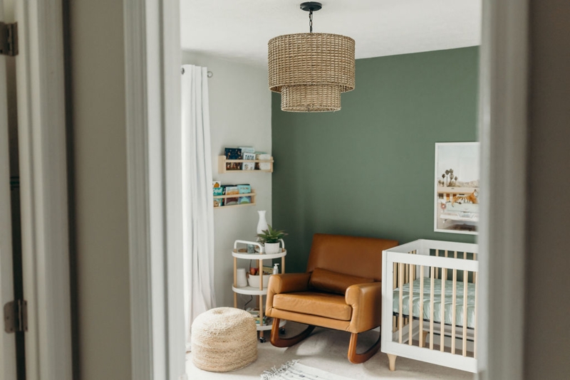 Boho Chic Nursery: Sage Green Accent Wall with Tan Leather Rocker