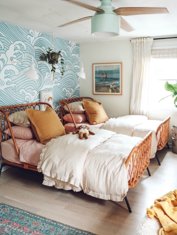 Boho Coastal Twin Bedroom with Blue Wave Wallpaper and Cane Beds