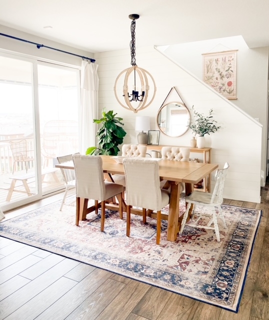 Boho Dining Room featuring Medallion Rug and Orb Chandelier