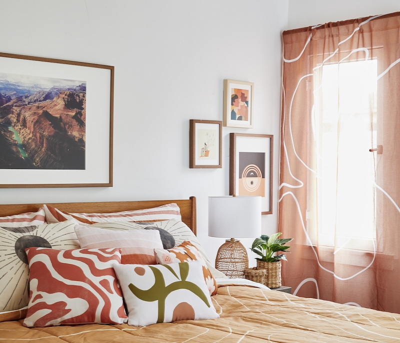 Boho Gallery Wall Over Bed with Earthy Terracotta and Sage Tones