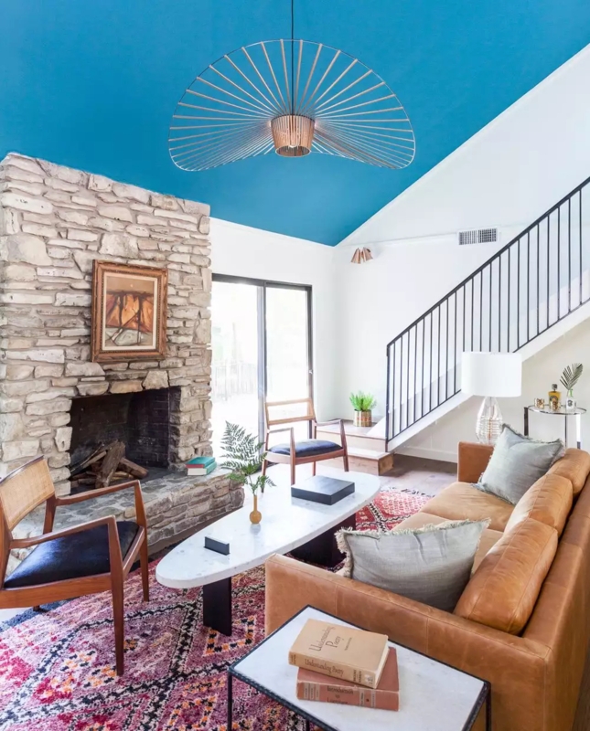 Bold Eclectic Living Room: Teal Ceiling & Stone Fireplace