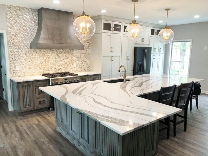 Bold Veined Quartz Kitchen Island with Slatted Gray Cabinetry Base