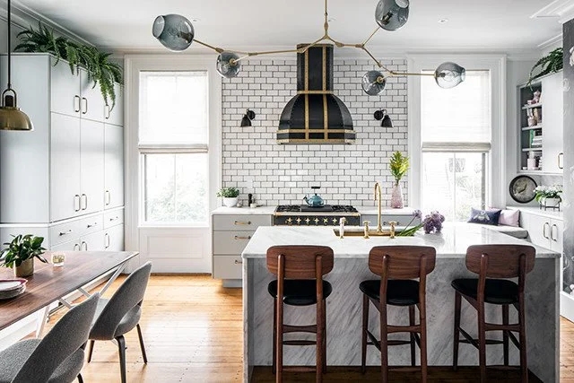 Branching Chandelier Kitchen Lighting with Marble Waterfall Island