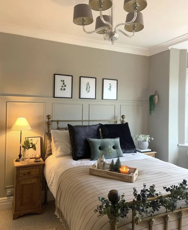 Brass Bed Frame Styling against Traditional Sage Green Wainscoting Wall