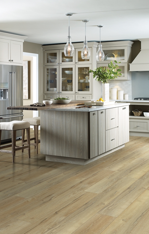 Bright Kitchen with Wide Plank Light Oak Floor and Two-Tier Island